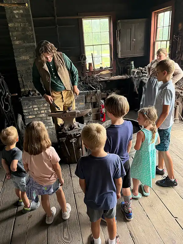 Children watching the Blacksmith